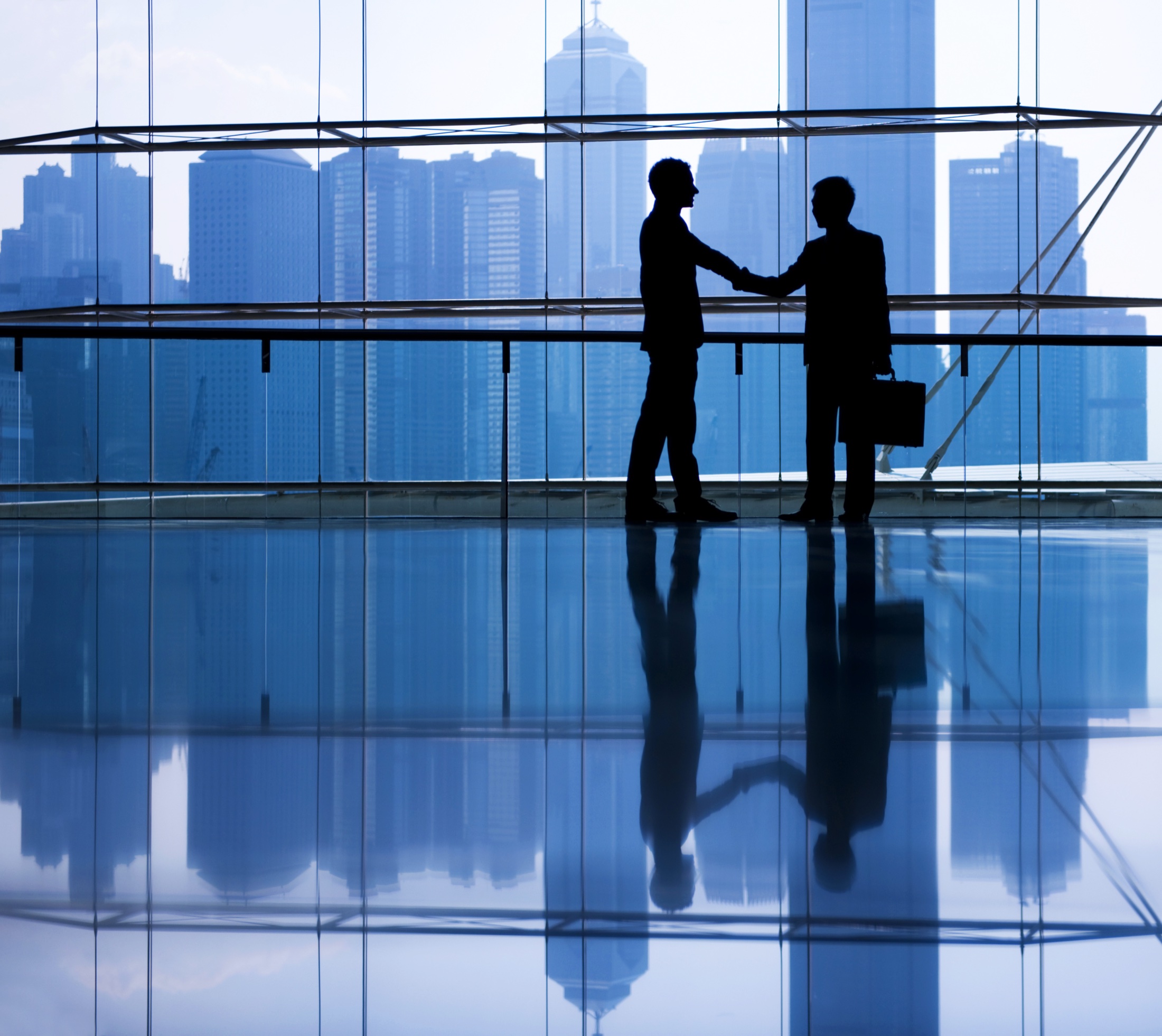 Business partners making agreement in modern office